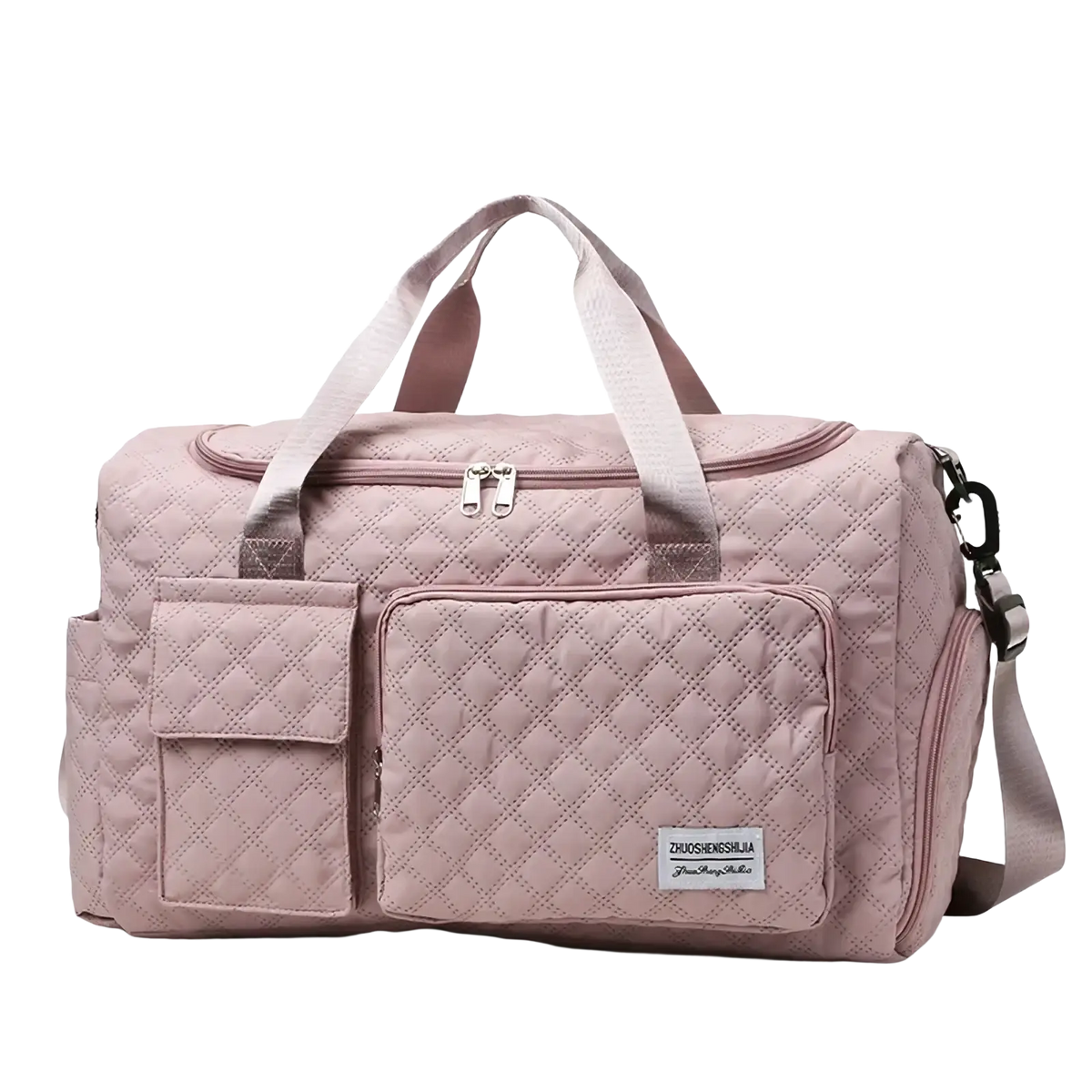 A soft pink quilted large travel duffel bag with waterproof material, dual top handles, and detachable shoulder strap