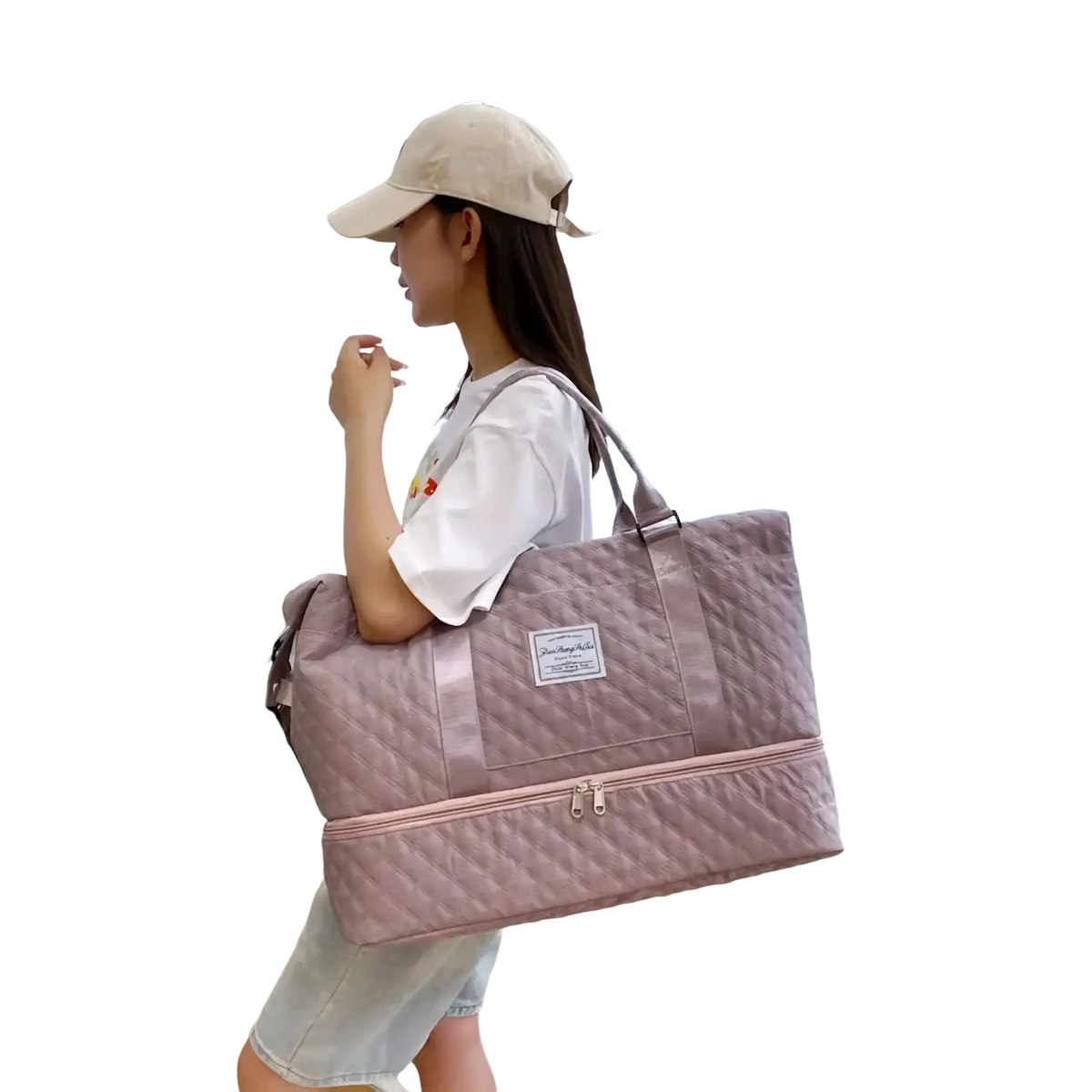 A soft pink quilted travel duffel bag with matching zipper and handle large weekender tote for travel use