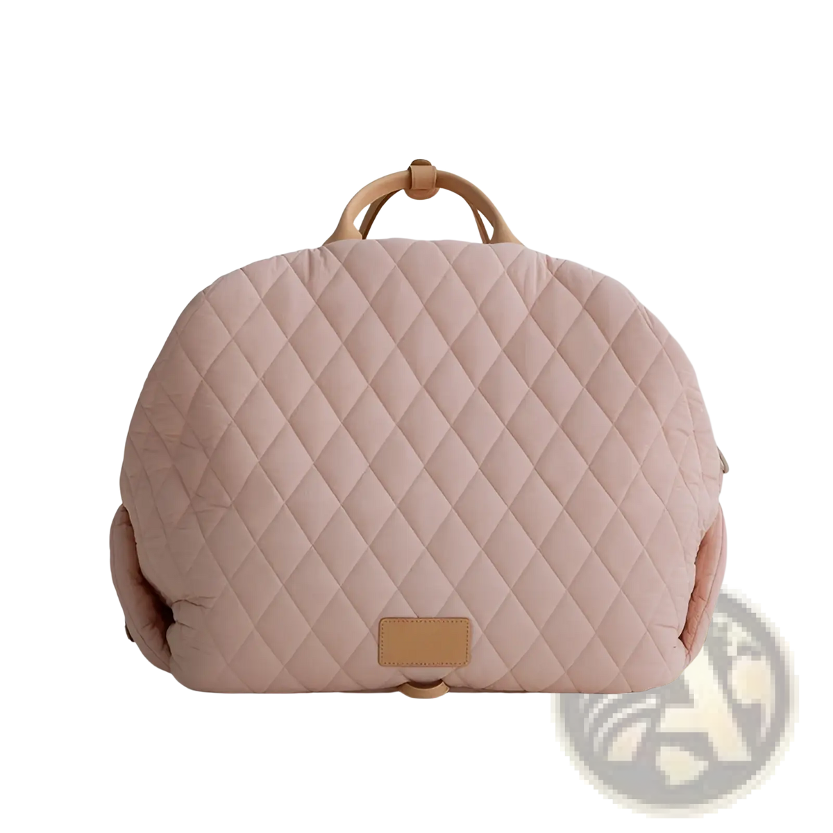 A soft blush pink quilted travel pet carrier bag with diamond pattern tan leather handles and matching leather patch