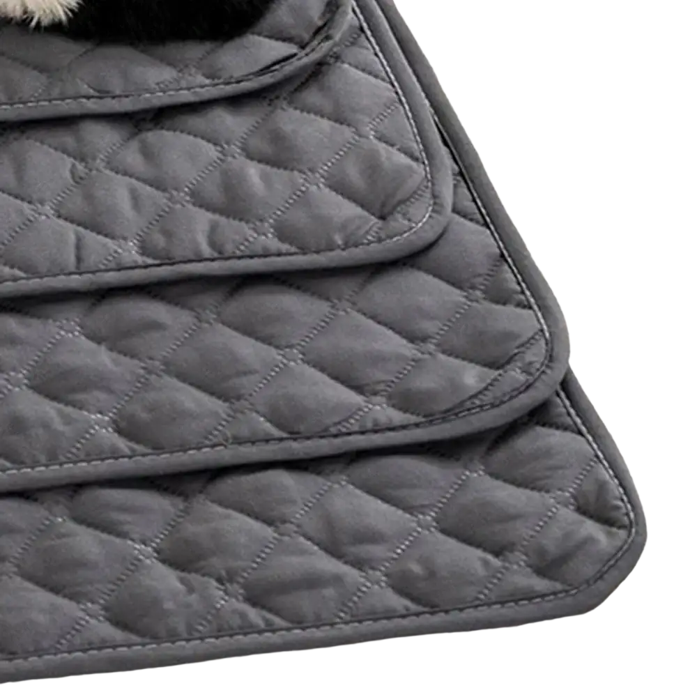 Gray quilted waterproof pet mat with diamond stitching and soft padded texture for furniture protection