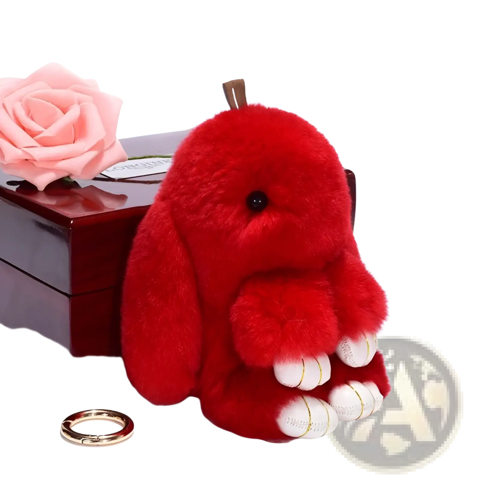 A plush red bunny keychain with long floppy ears black bead eyes and white paw pads accented with gold stitching