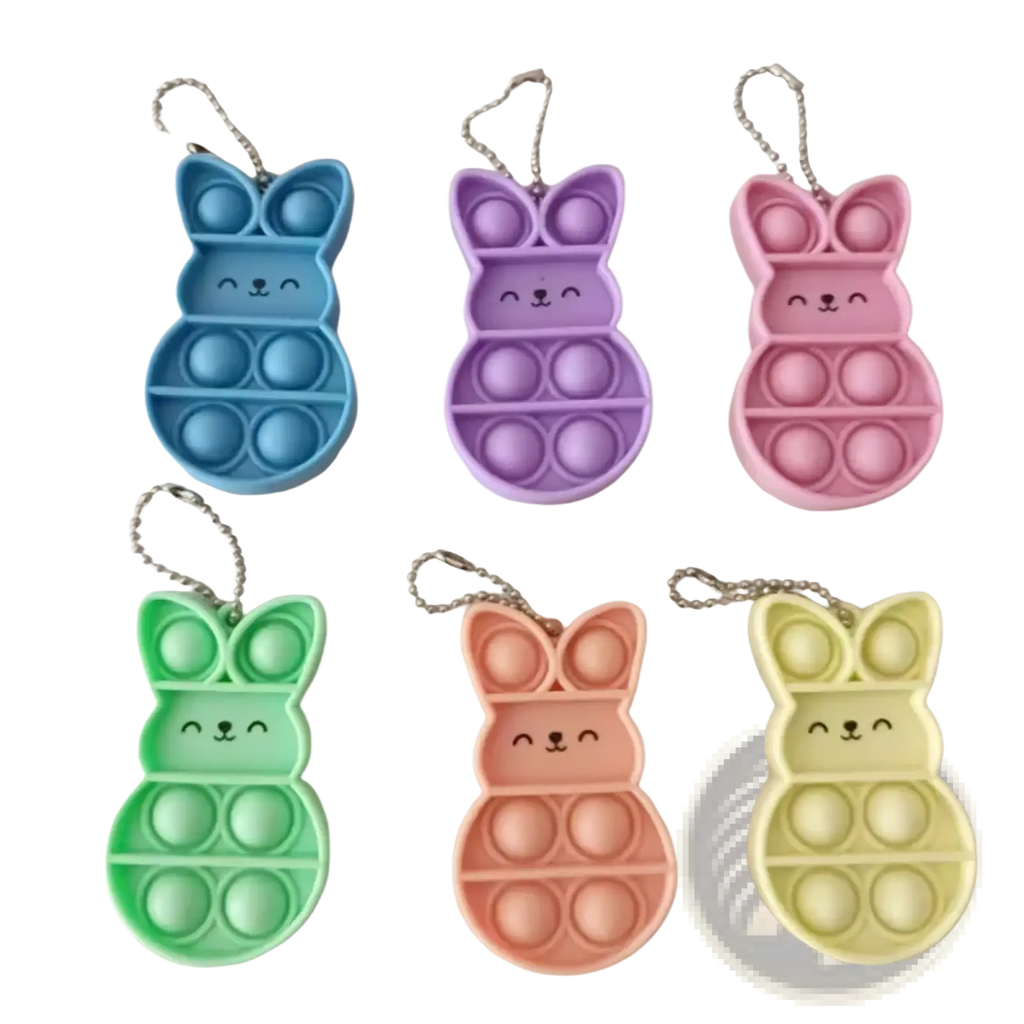 Pastel-colored rabbit pop it fidget keychains with soft silicone bodies and metallic chain attachments