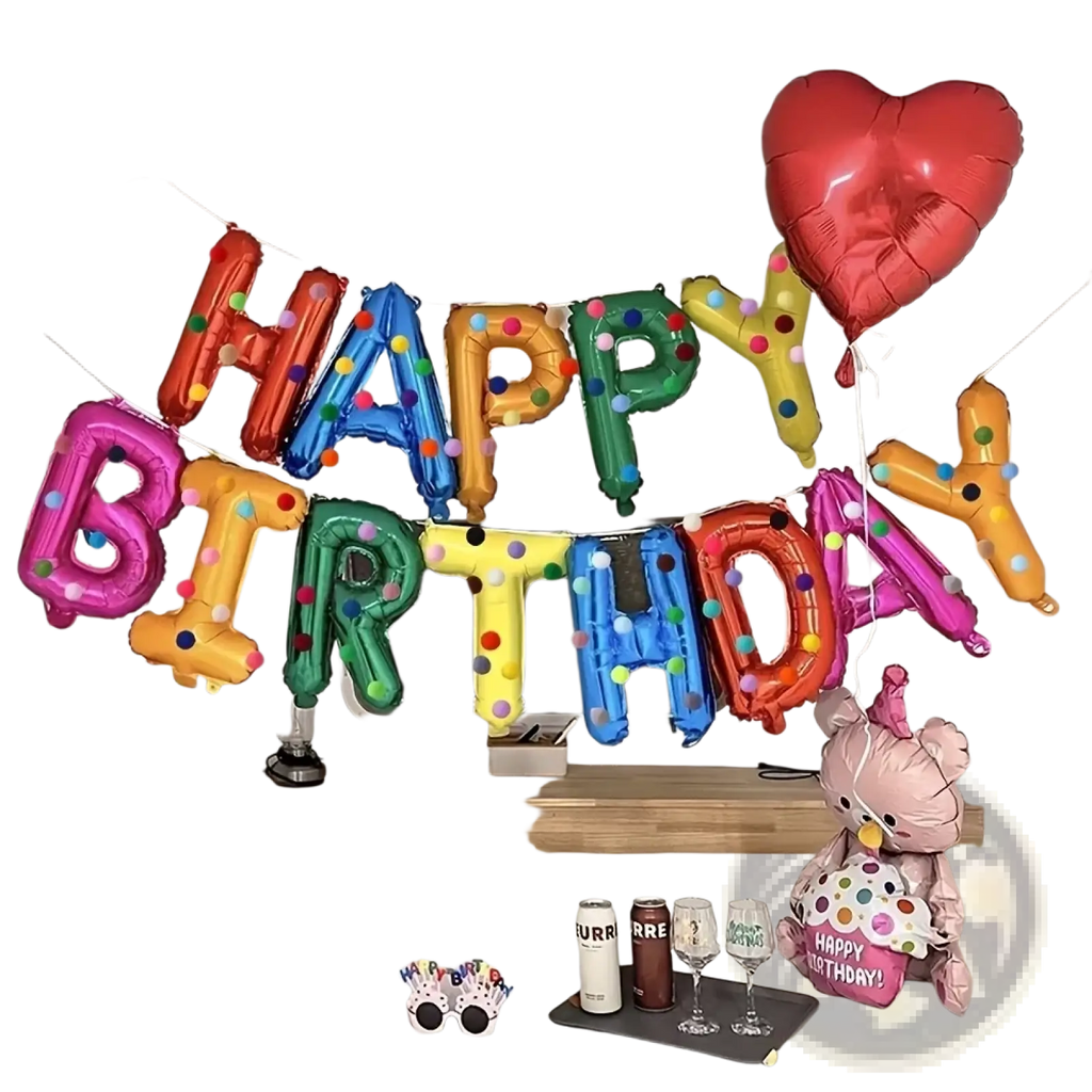 A vibrant rainbow birthday balloon banner with multi-colored letters, polka-dot accents, and a red heart balloon