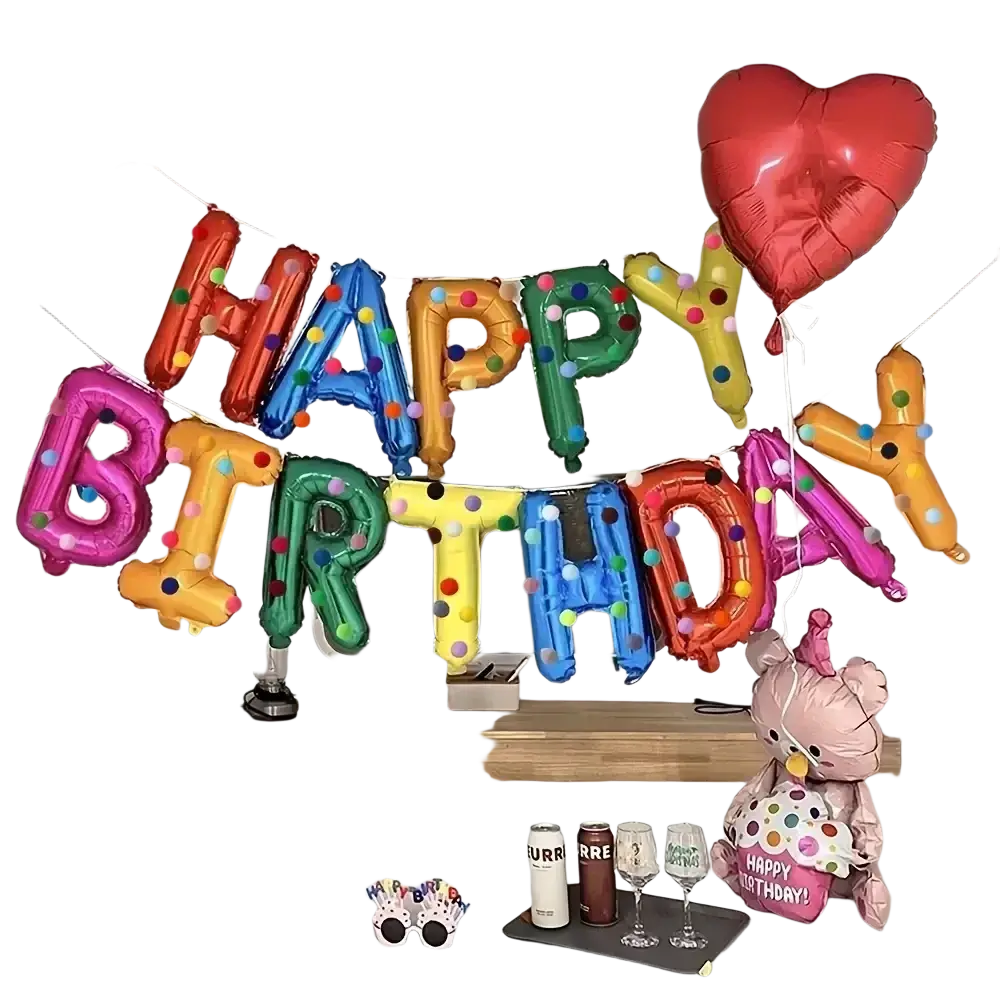 Rainbow birthday balloon banner party decoration featuring vibrant multicolored letters and a red heart-shaped balloon