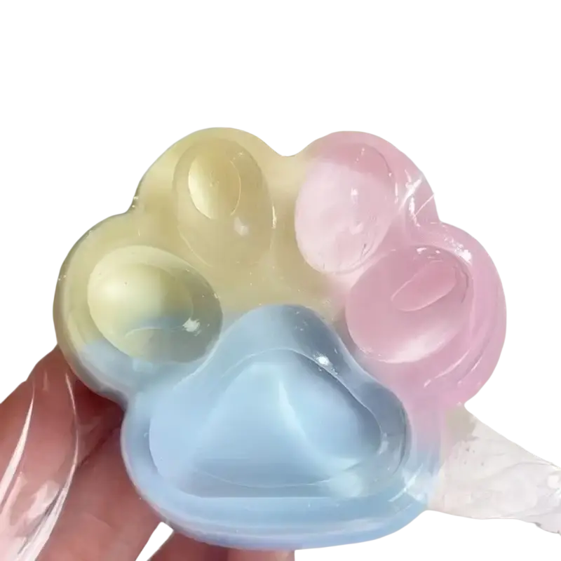 Pastel gradient rainbow cat claw squishy fidget toy made of soft translucent silicone paw-shaped material