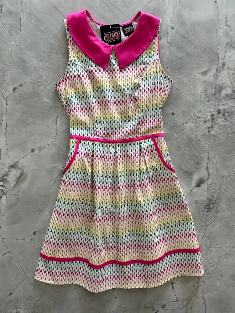 Sleeveless rainbow drop retro 60s cotton dress with vibrant pink peter pan collar and multicolored dot pattern
