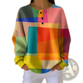 A vibrant long-sleeved rainbow geometric henley sweatshirt for women made of textured knit fabric