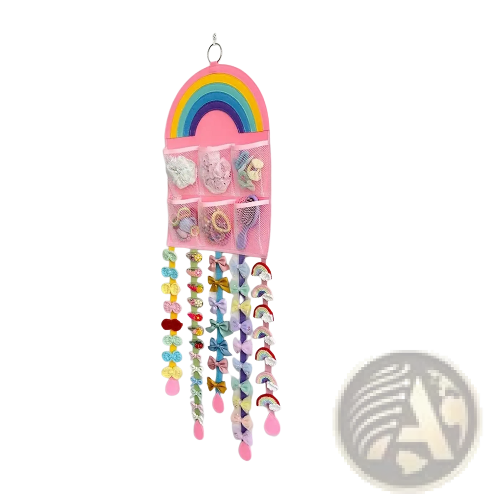 Pink rainbow-themed wall-mounted hair accessory hanging organizer with mesh pockets and dangling bow clips