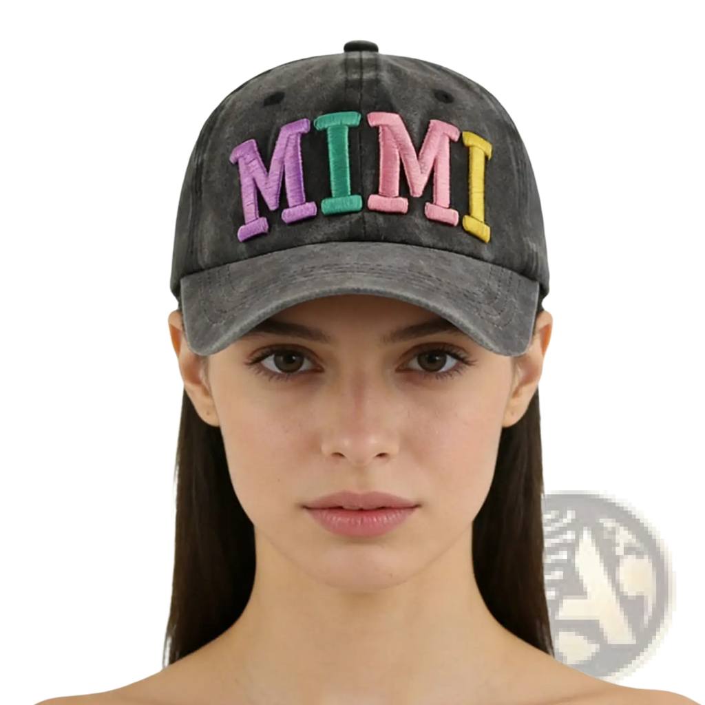 A faded gray baseball cap with mimi embroidered in colorful rainbow-striped letters on the front
