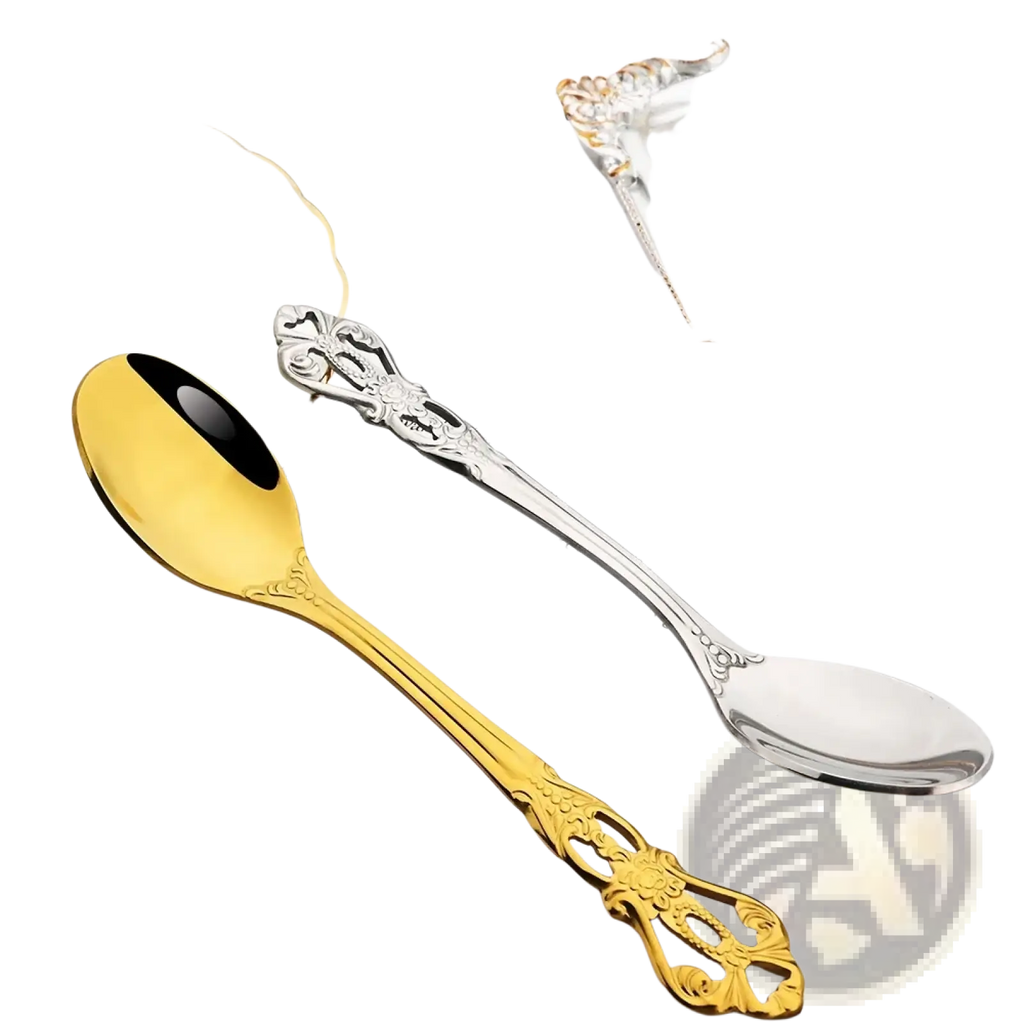 Gold and silver ornate spoons with intricate floral designs on handles from the rainbow stainless steel floral flatware set
