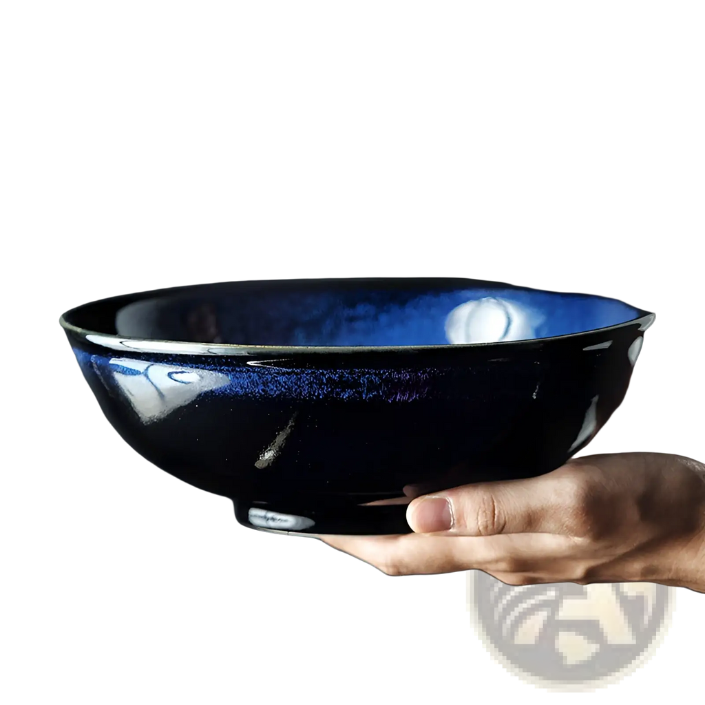 A deep blue ceramic ramen bowl with glossy iridescent glaze and metallic accents, 8.5 inch cat eye noodle bowl