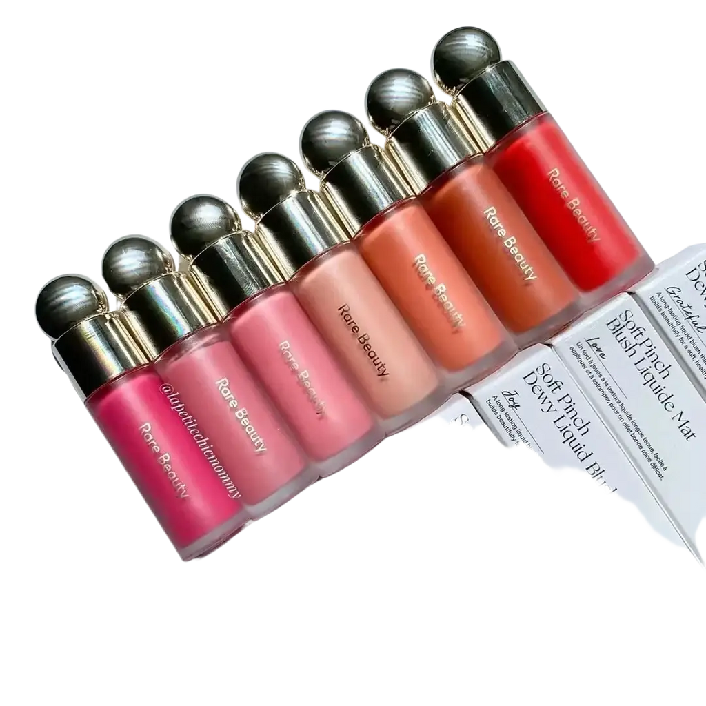 A row of rare beauty soft pinch liquid blushes in vibrant shades with sleek transparent tubes and gold caps