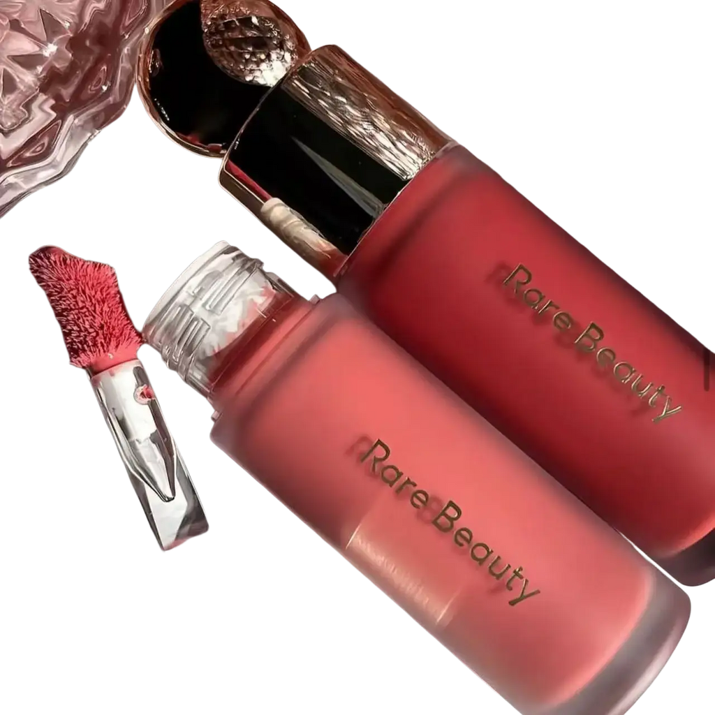 Two matte coral pink rare beauty soft pinch liquid blushes with rose gold caps and clear glass applicators