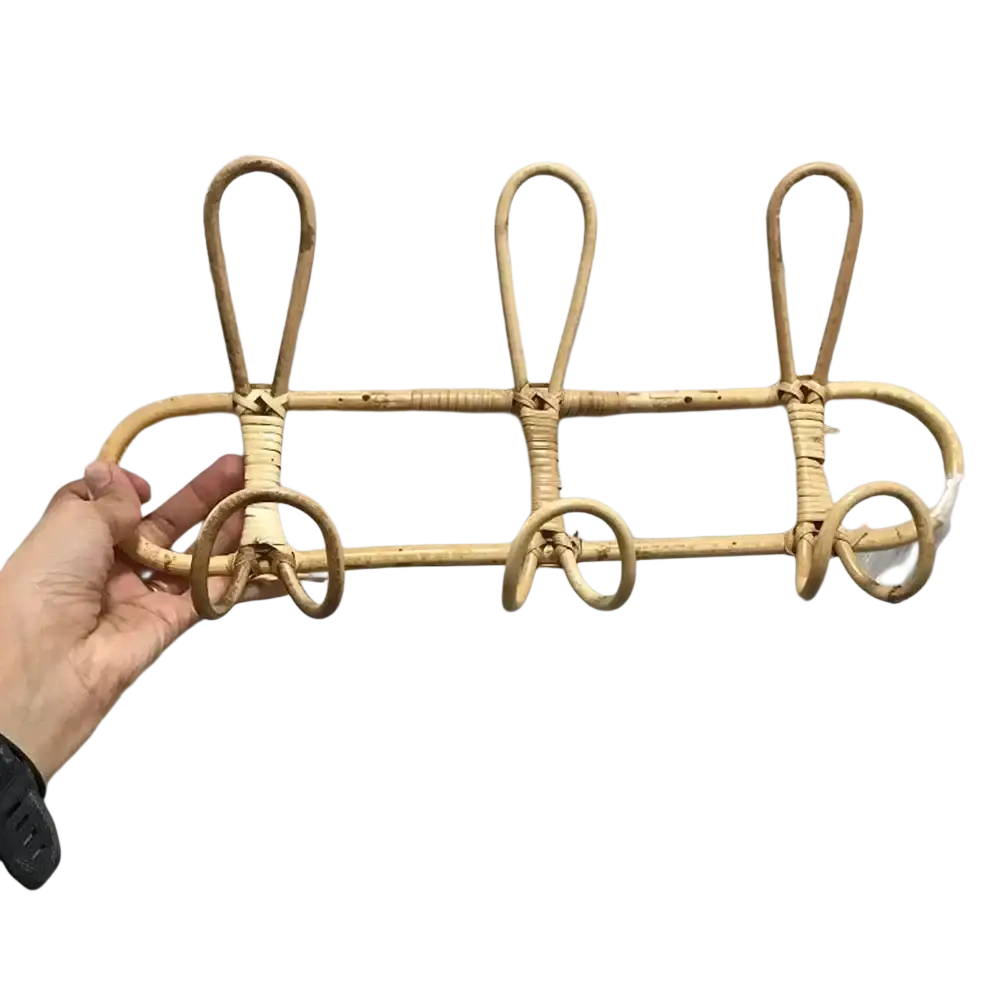Natural-toned rattan kids wall hook rack with three curved hooks and woven rustic design for clothing storage