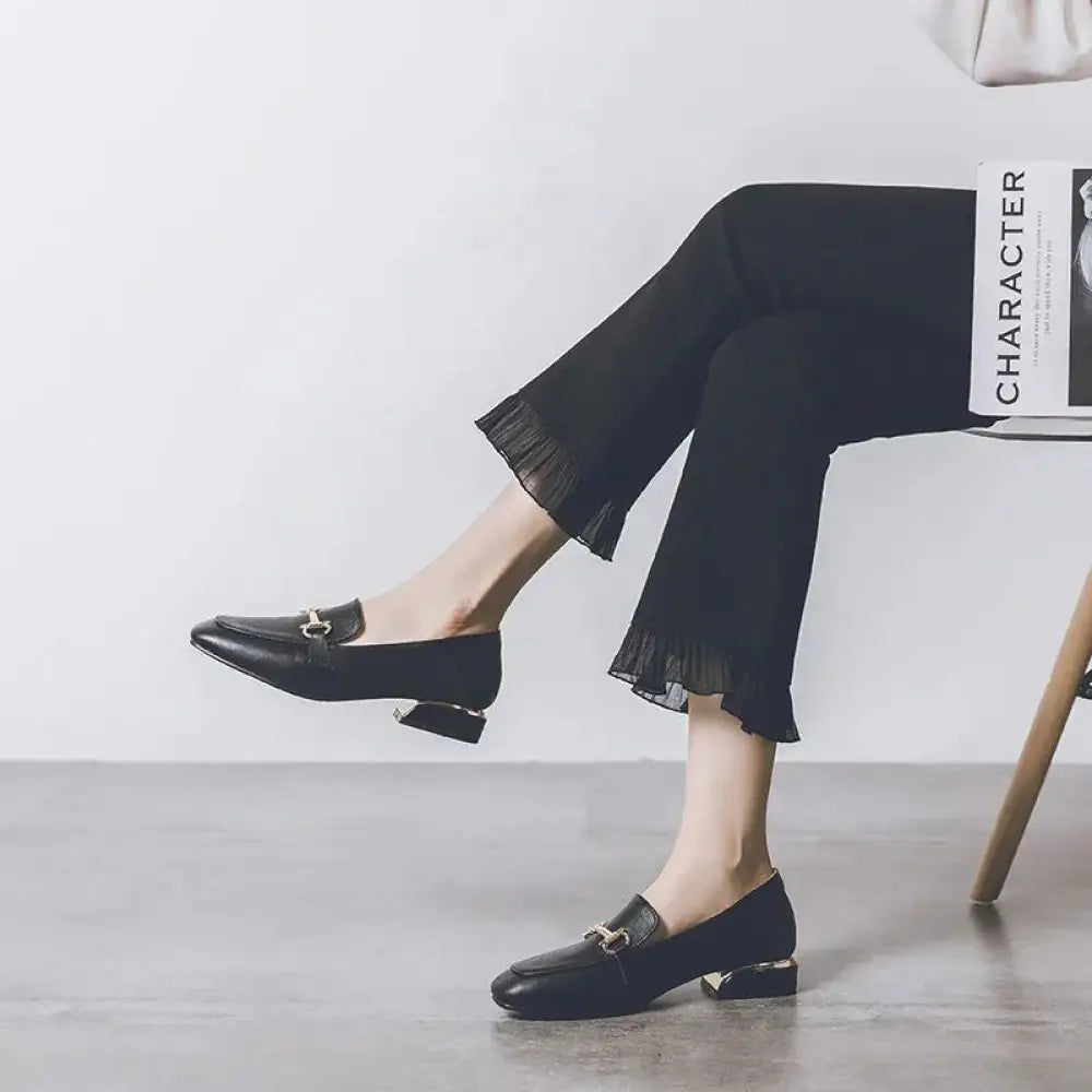 Black leather women’s british style loafers with metallic horsebit buckle and block heels in soft leather