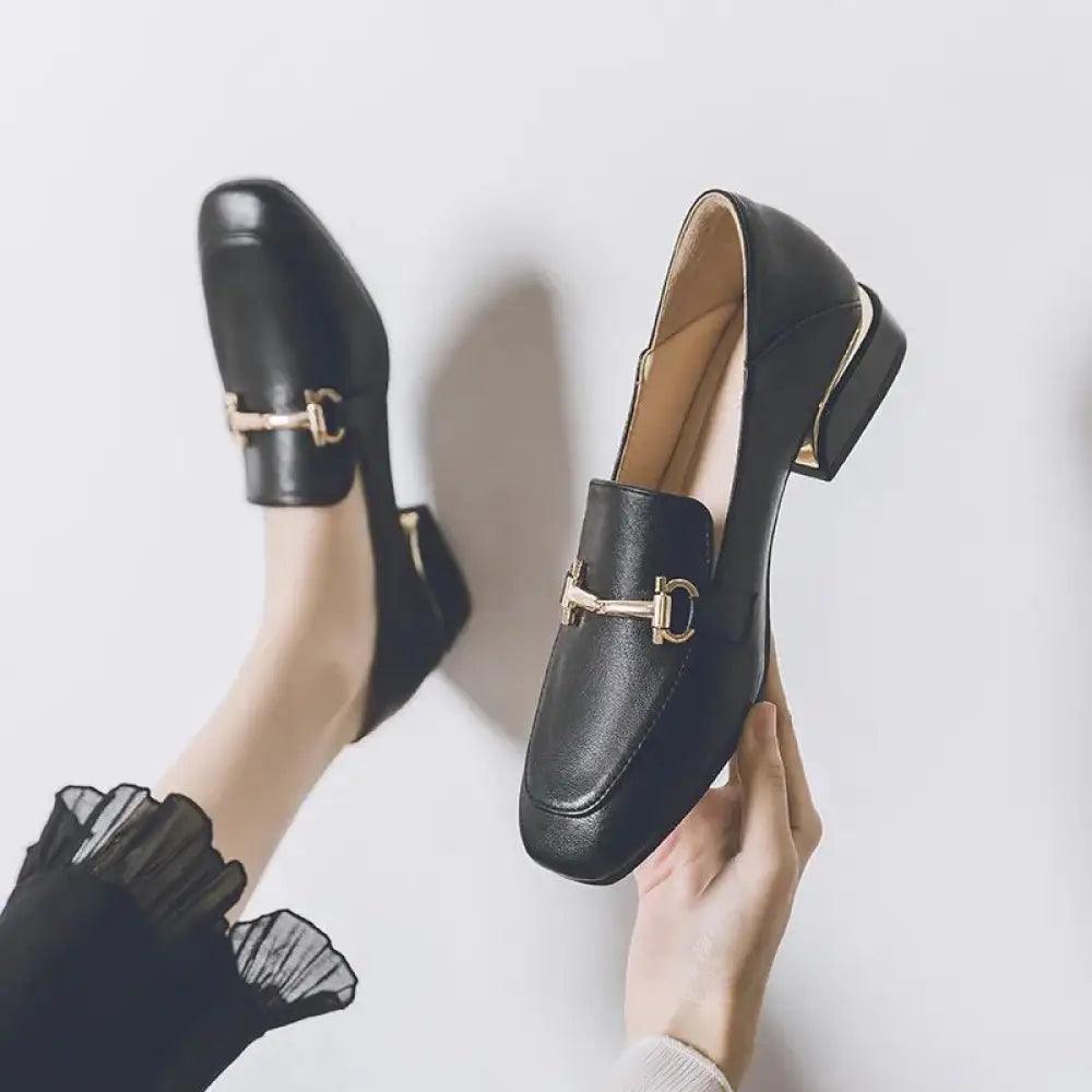 Black leather women’s loafers with gold-tone horsebit buckle and low block heels british style soft leather