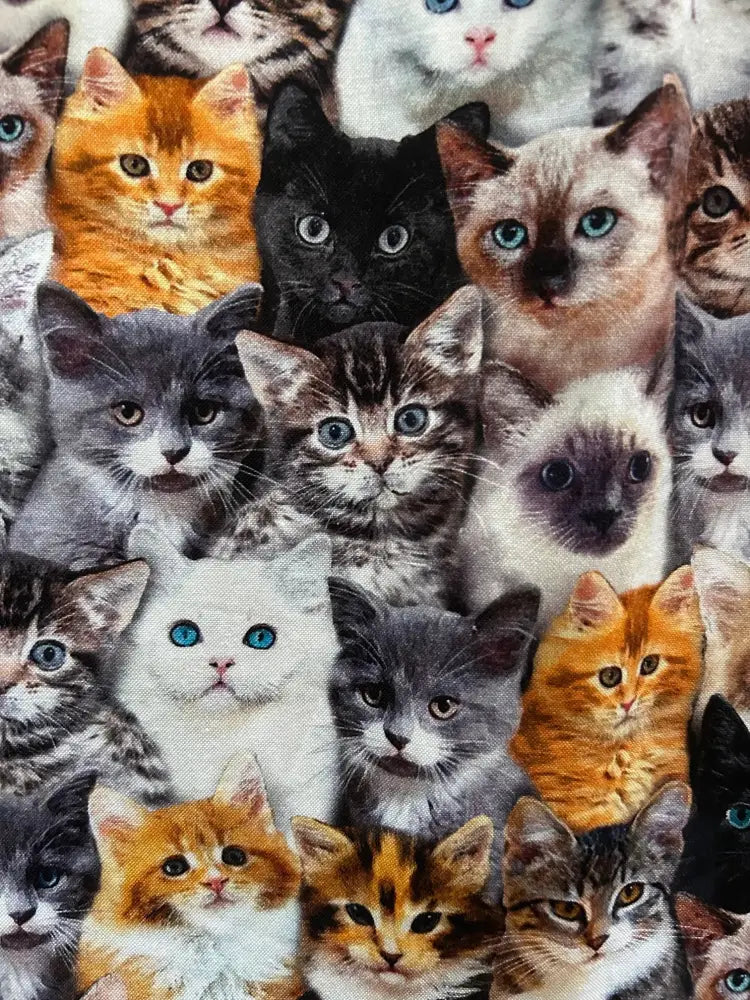 Vibrant vintage midi dress with pockets featuring densely packed realistic cat faces in various breeds and colors