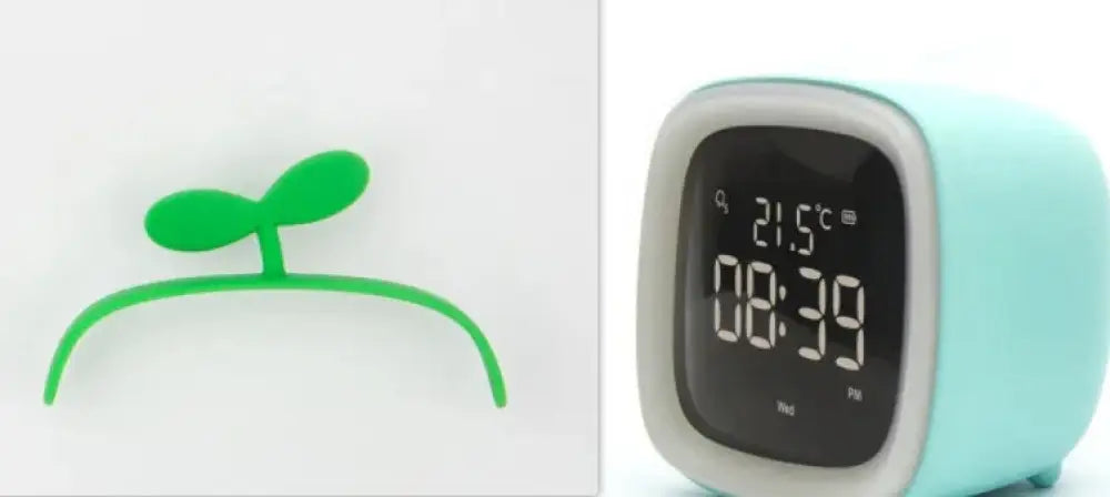 Kids animal digital alarm clock in mint green with white border and black display showing time and temperature