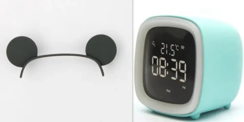 Mint green kids animal digital alarm clock with night light and temperature display and gray trim around the screen