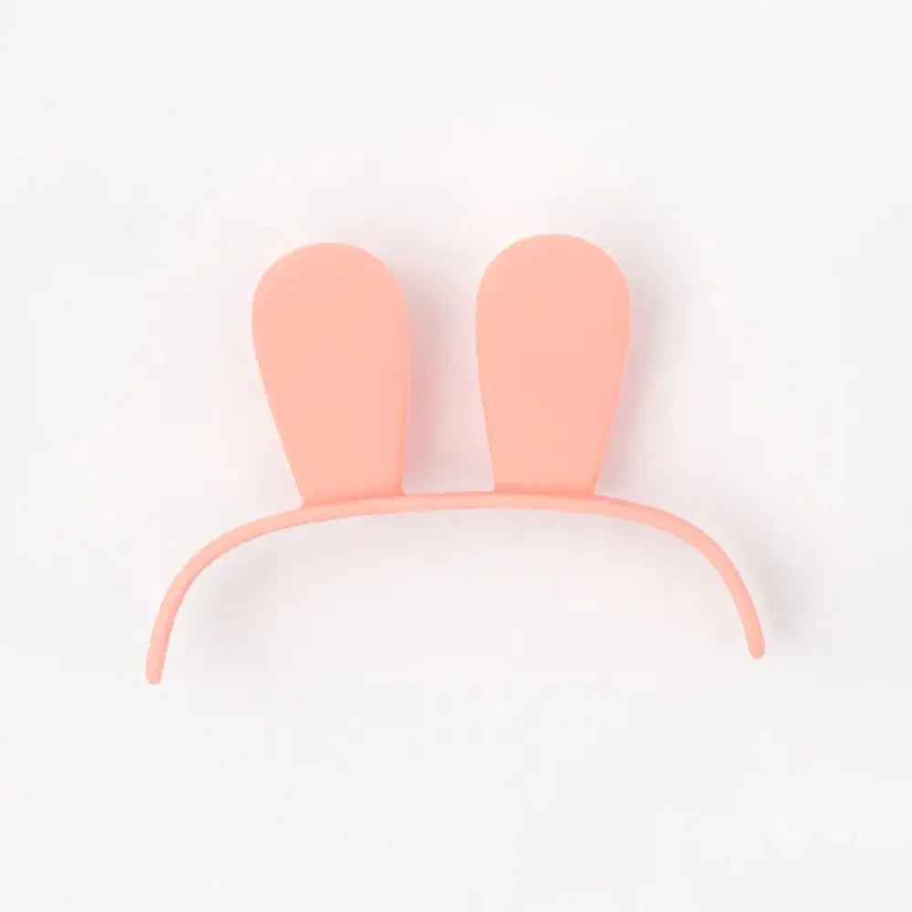 Pastel pink bunny ear headband with smooth flexible band paired with kids animal digital alarm clock with night light and temp
