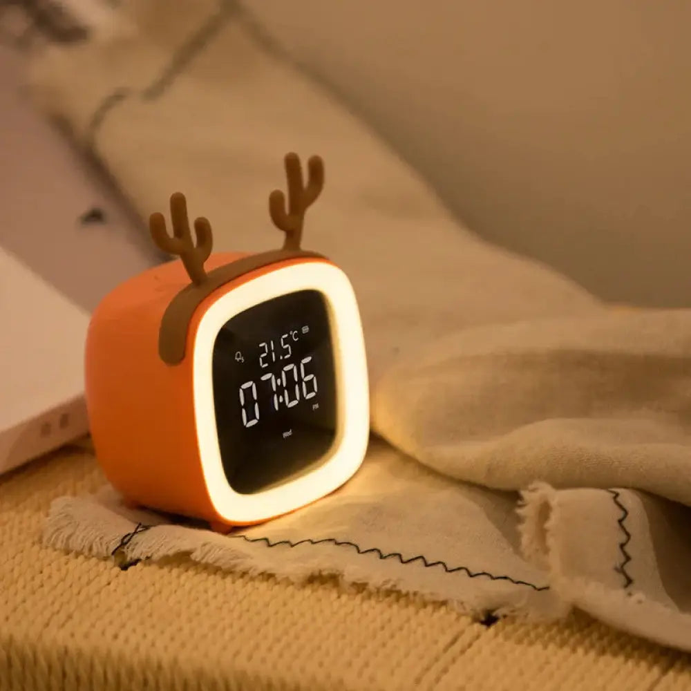 Orange kids animal digital alarm clock with antler decorations night light temperature display and glowing white border