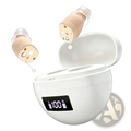 Beige in-ear rechargeable digital hearing aids with clear silicone tips inside a white charging case showing battery level