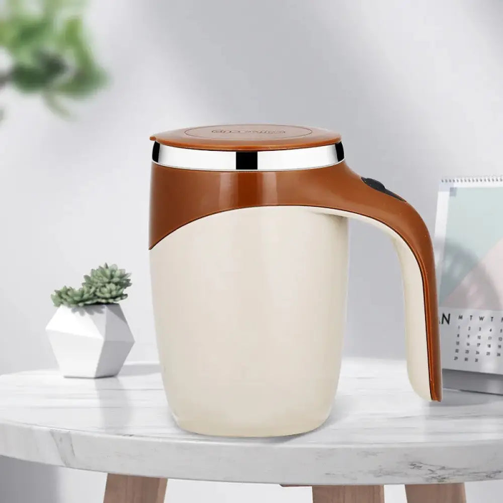 Cream-colored electric self stirring magnetic coffee mug with usb charging brown handle lid and metallic rim