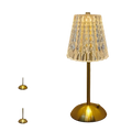 Gold-finished rechargeable table lamp with faceted crystal glass shade serving as a touch LED light source