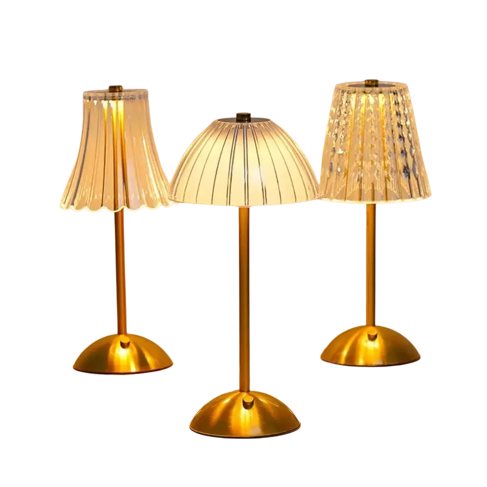 Three elegant gold rechargeable table lamps with distinct glass shades providing versatile light source
