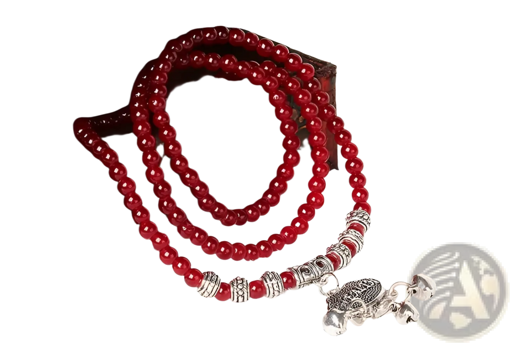 A vibrant red agate good luck bracelet with silver-toned spacers and a detailed engraved turtle protect charm