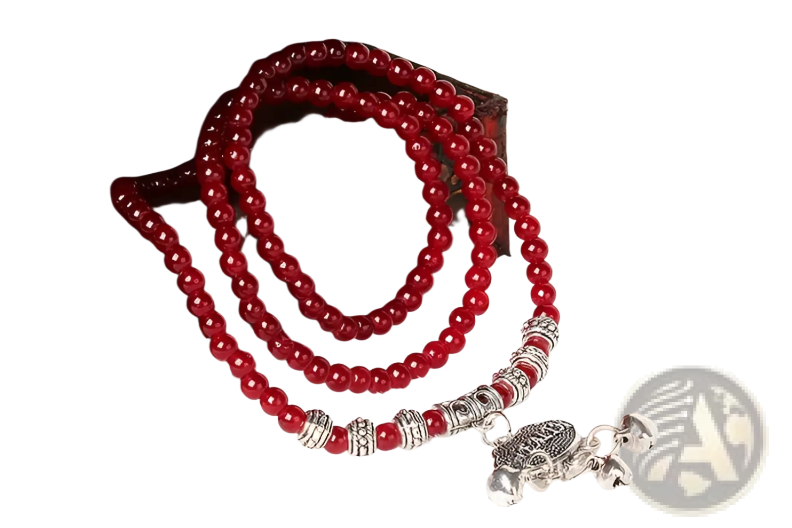 A vibrant red agate good luck bracelet with silver-toned spacers and a detailed engraved turtle protect charm