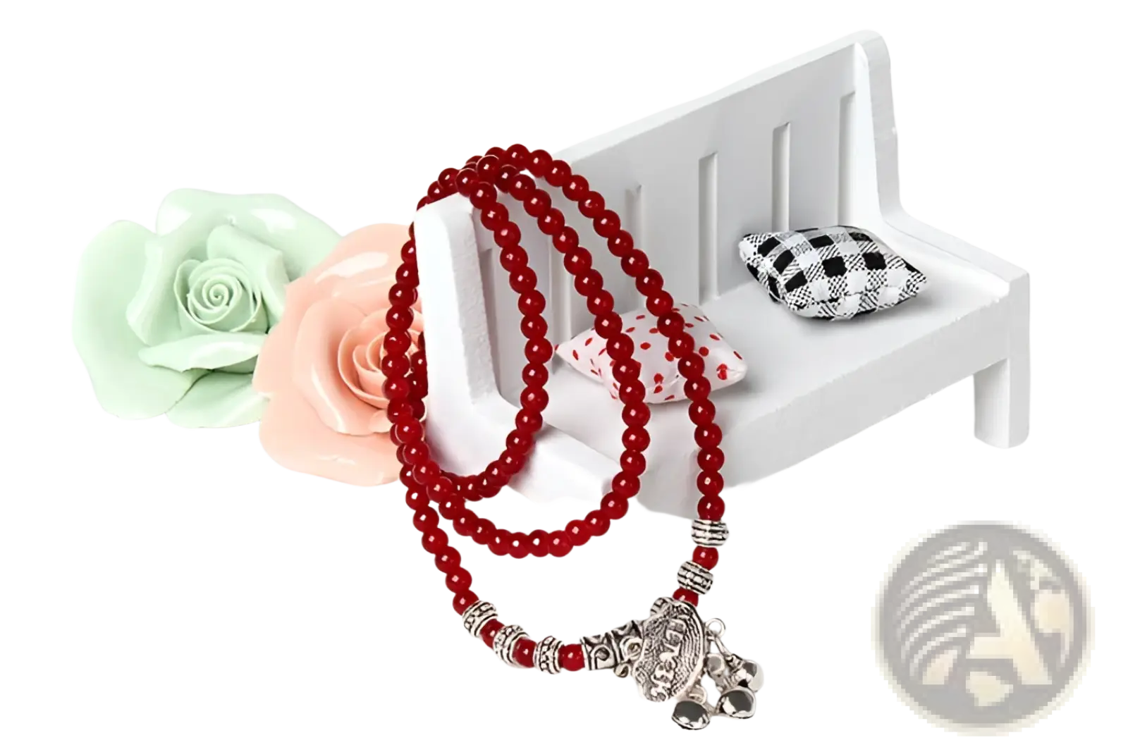 Red agate good luck bracelet featuring red beaded rosary with silver-toned accents and detailed elephant pendant