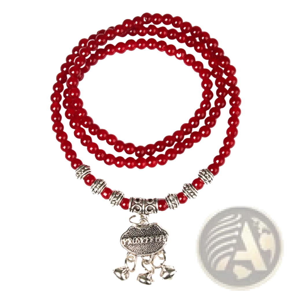 Red agate good luck bracelet with red beads silver spacers and a dangling charm with engraved heart and bells