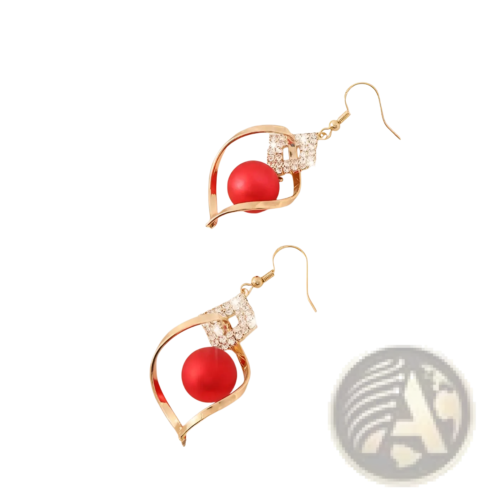 Gold-toned dangle earrings with a vibrant red bead in an open swirling frame adorned with clear crystals