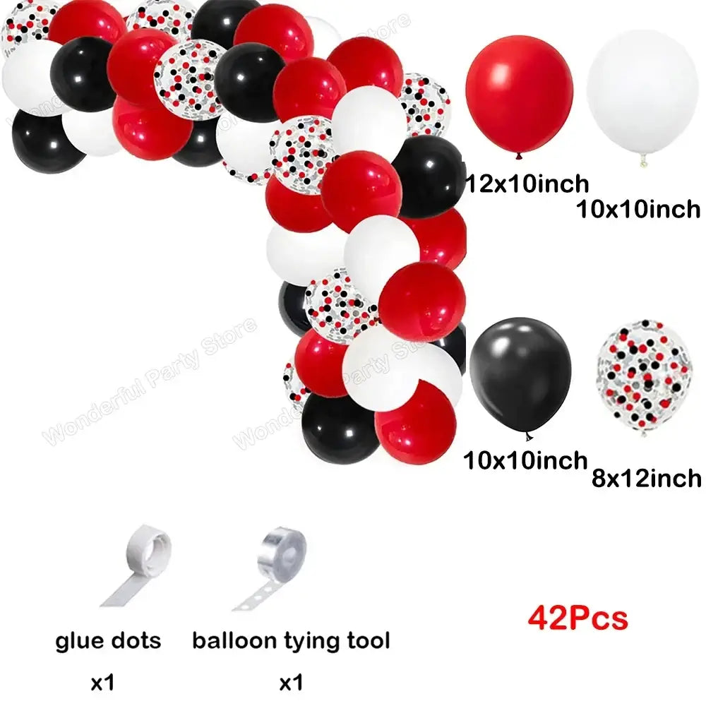 A festive red black and white balloon garland arch kit with glossy and confetti patterned balloons for party decoration