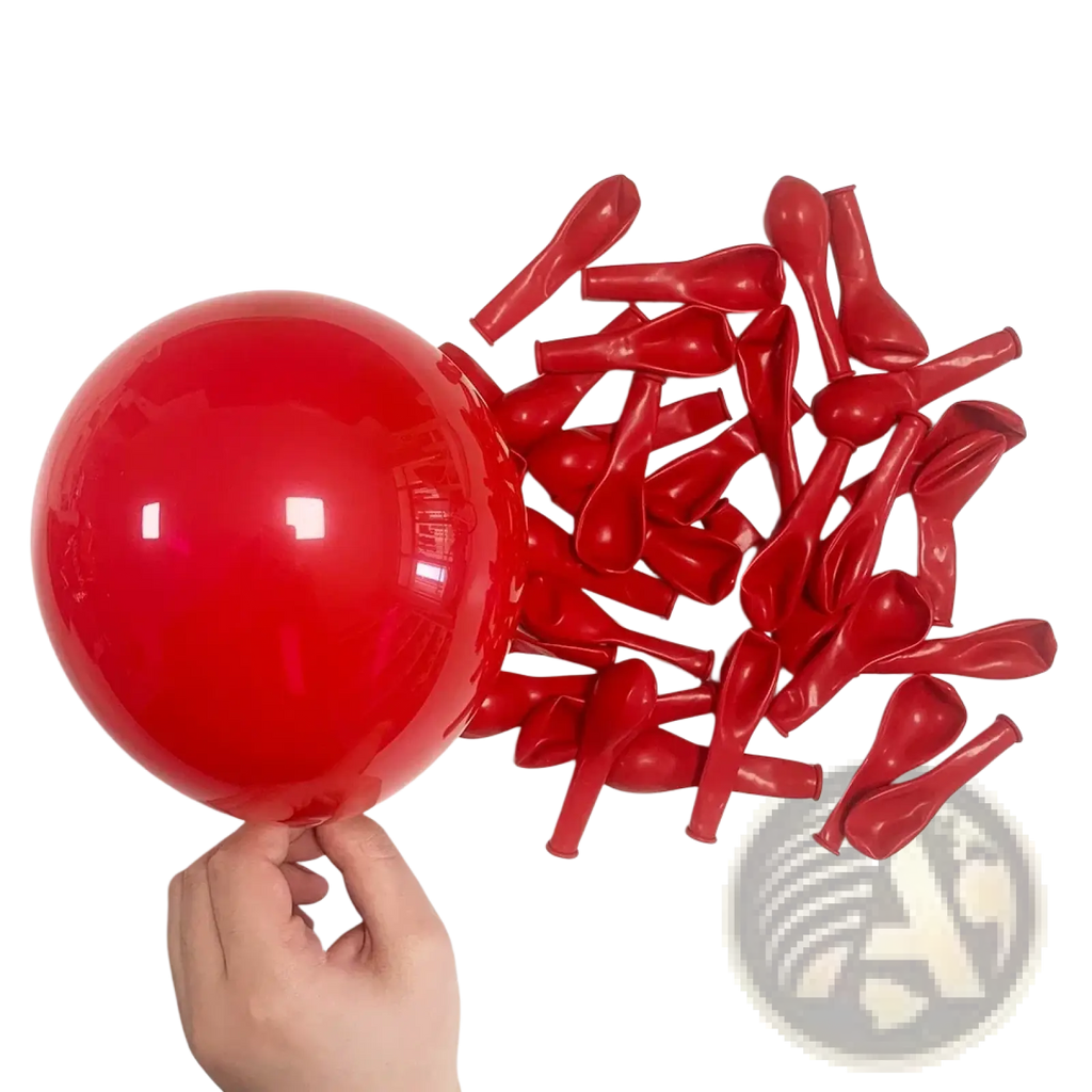 A single inflated red latex balloon held by hand among deflated red balloons from a red black balloon garland arch kit