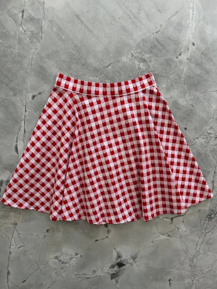 Red check kitties gingham pleated skater skirt in red and white with a classic gingham pattern and pleated design