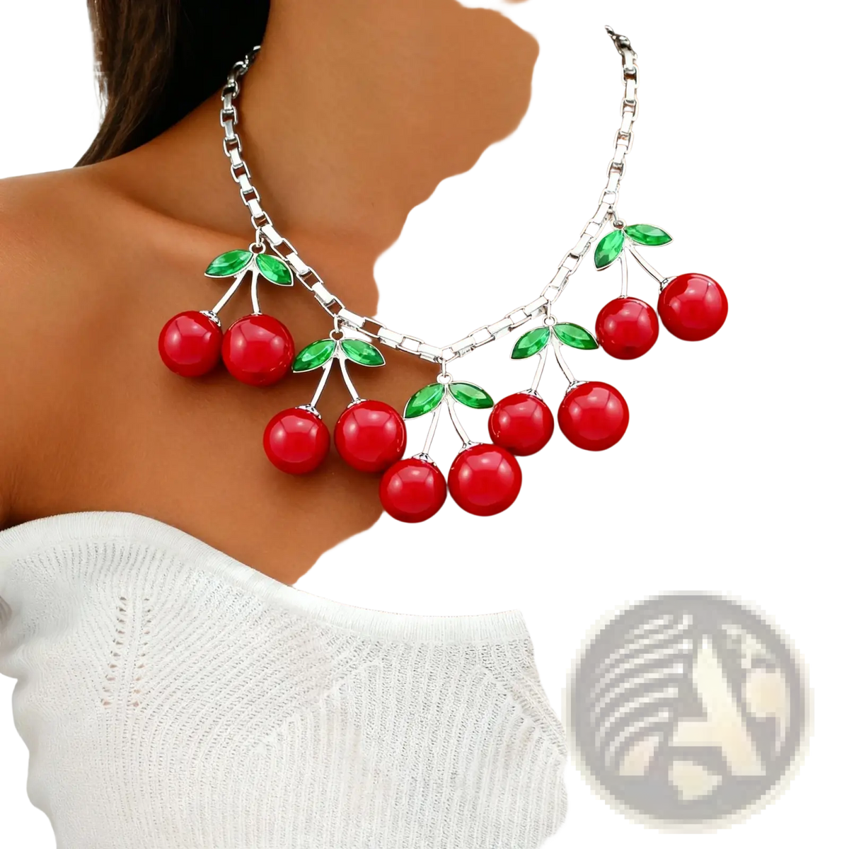Red cherry statement necklace featuring glossy resin cherries and green enamel leaves on a silver-toned chain