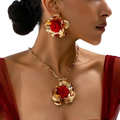 Red floral jewelry set gold rose necklace and earrings with gold-toned layered metallic petals and central red rose pendant