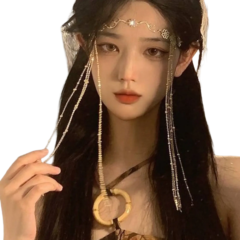Delicate gold forehead chain hair pendant with red gemstone featuring intricate floral and beaded cascading chains