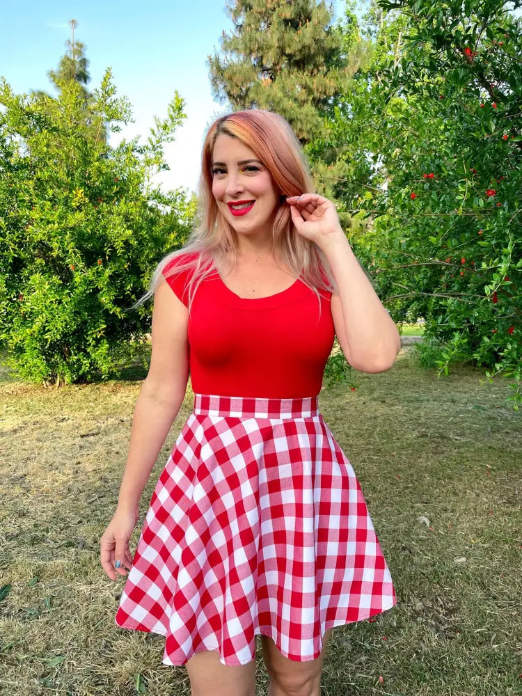 Red gingham high waisted a-line skater skirt with a flared silhouette in red and white gingham check pattern