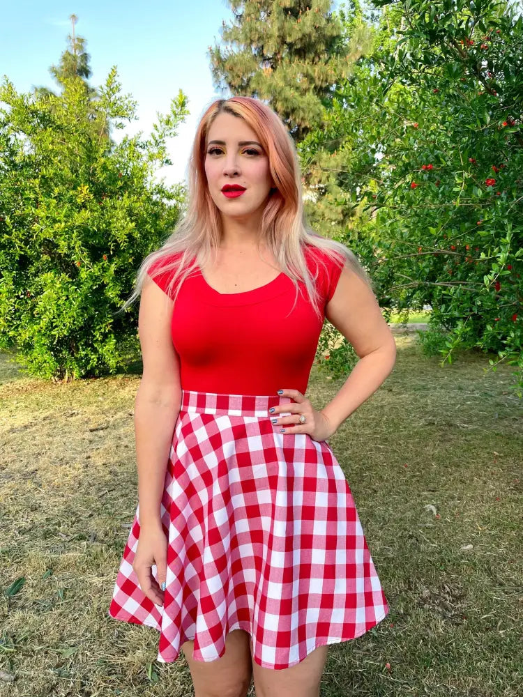 Red gingham high waisted a-line skater skirt with a flared silhouette in red and white gingham pattern