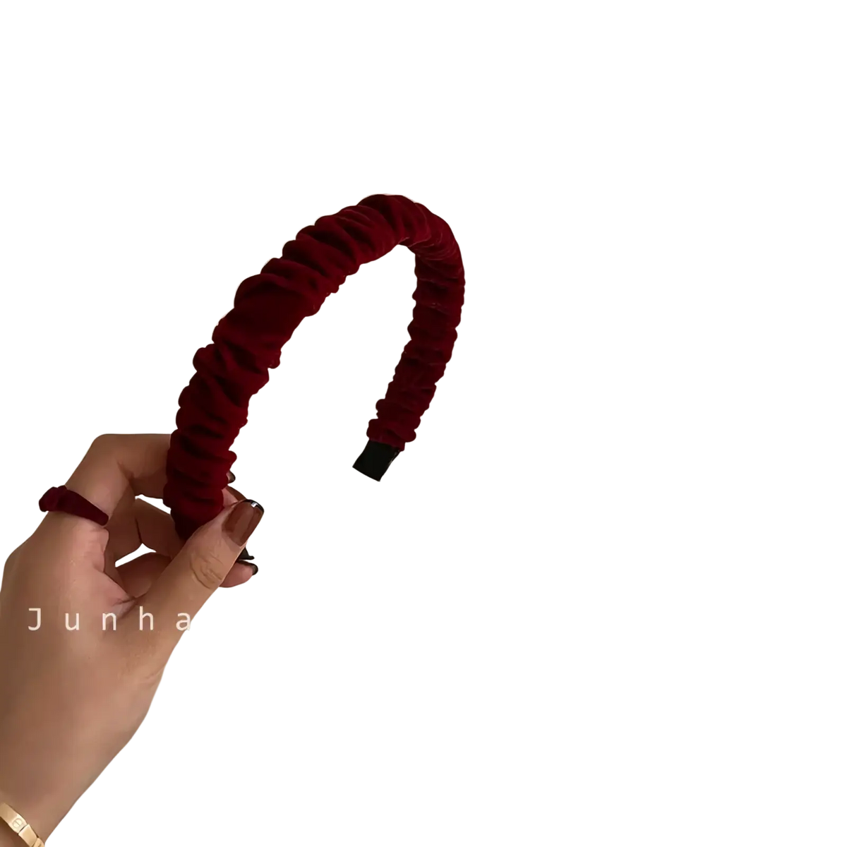 A plush deep red velvet knitted headband for women with ruched texture and a black plastic clasp closure
