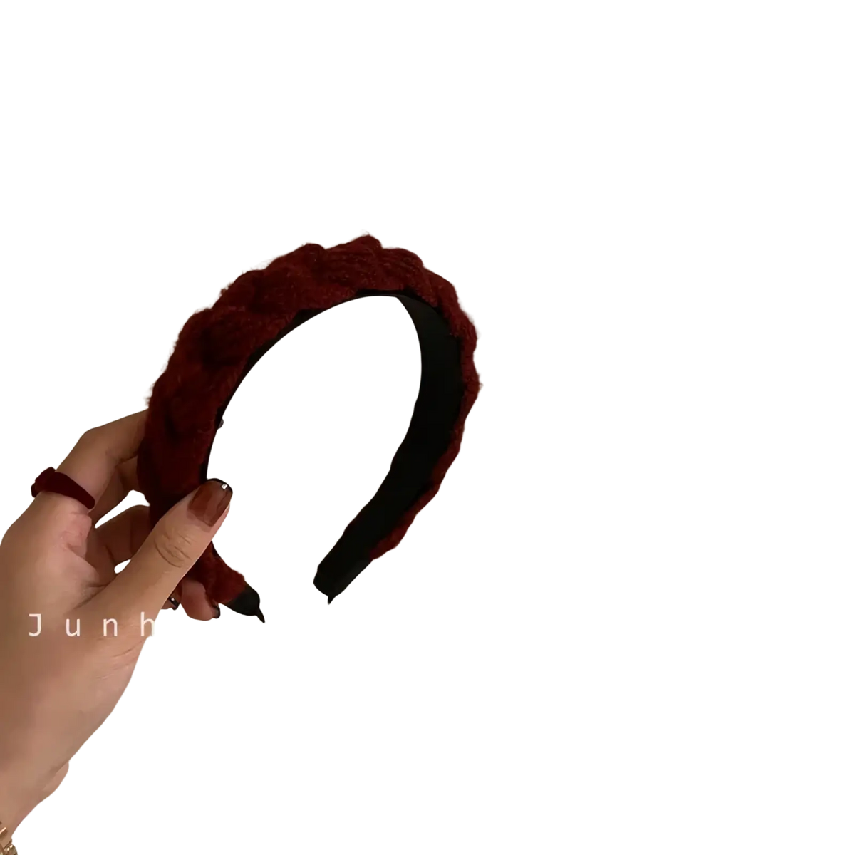 A deep red knitted headband for women with a plush braided design and a soft textured knit exterior