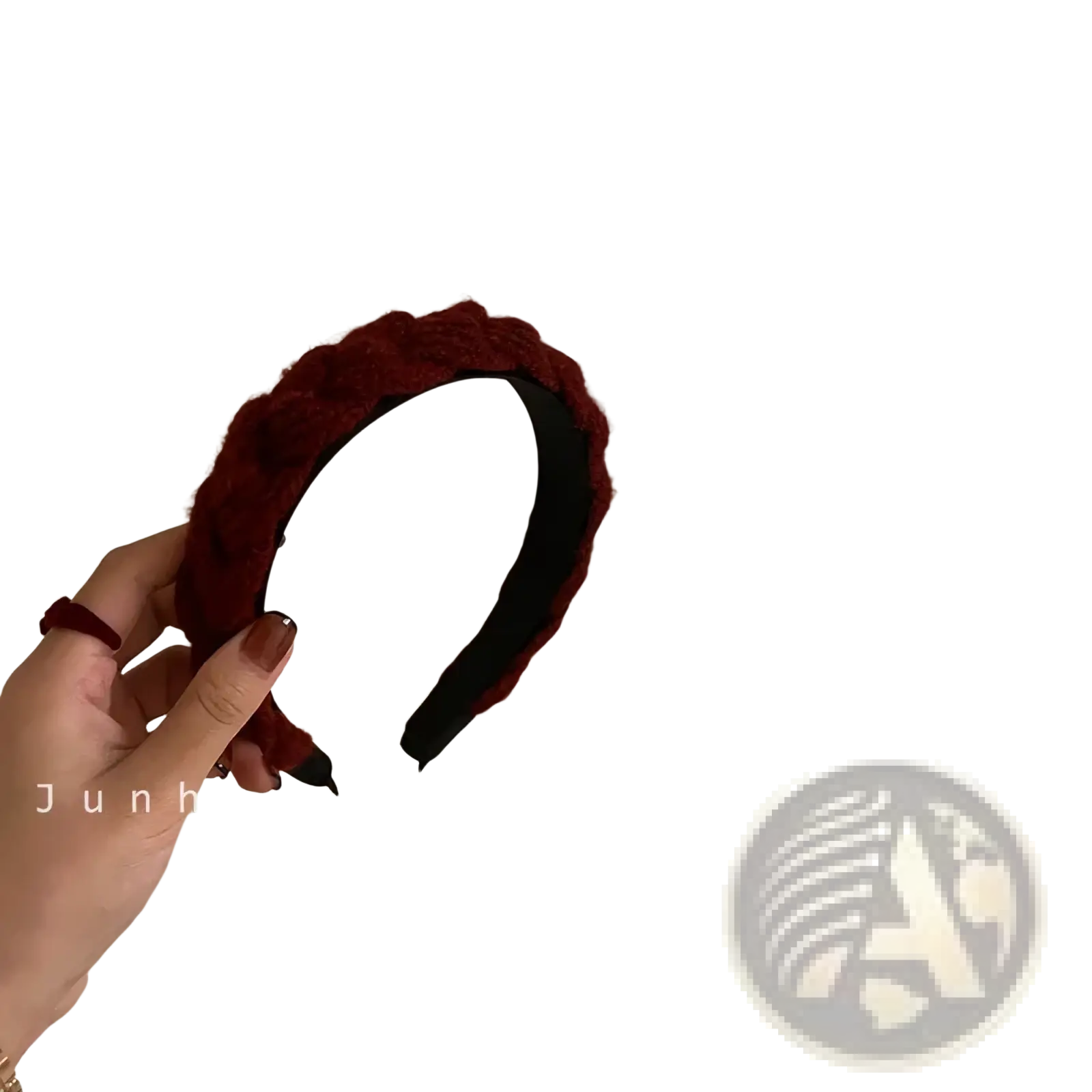 A deep red knitted headband for women with a plush braided design and a soft textured knit exterior