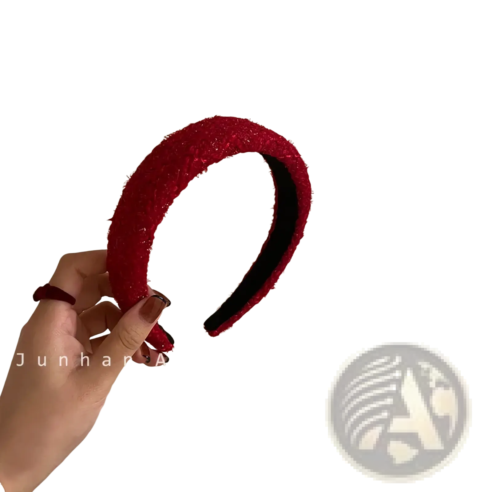 Red hair accessory knitted headband with vibrant red textured plush exterior and smooth black interior lining