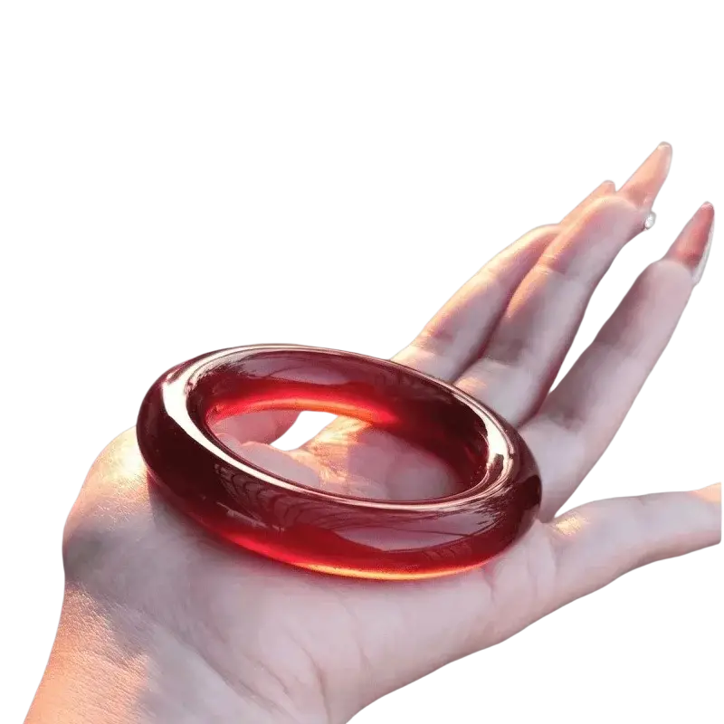 Red jade bangle bracelet for women with glossy deep red jade and smooth polished surface featuring subtle marbling
