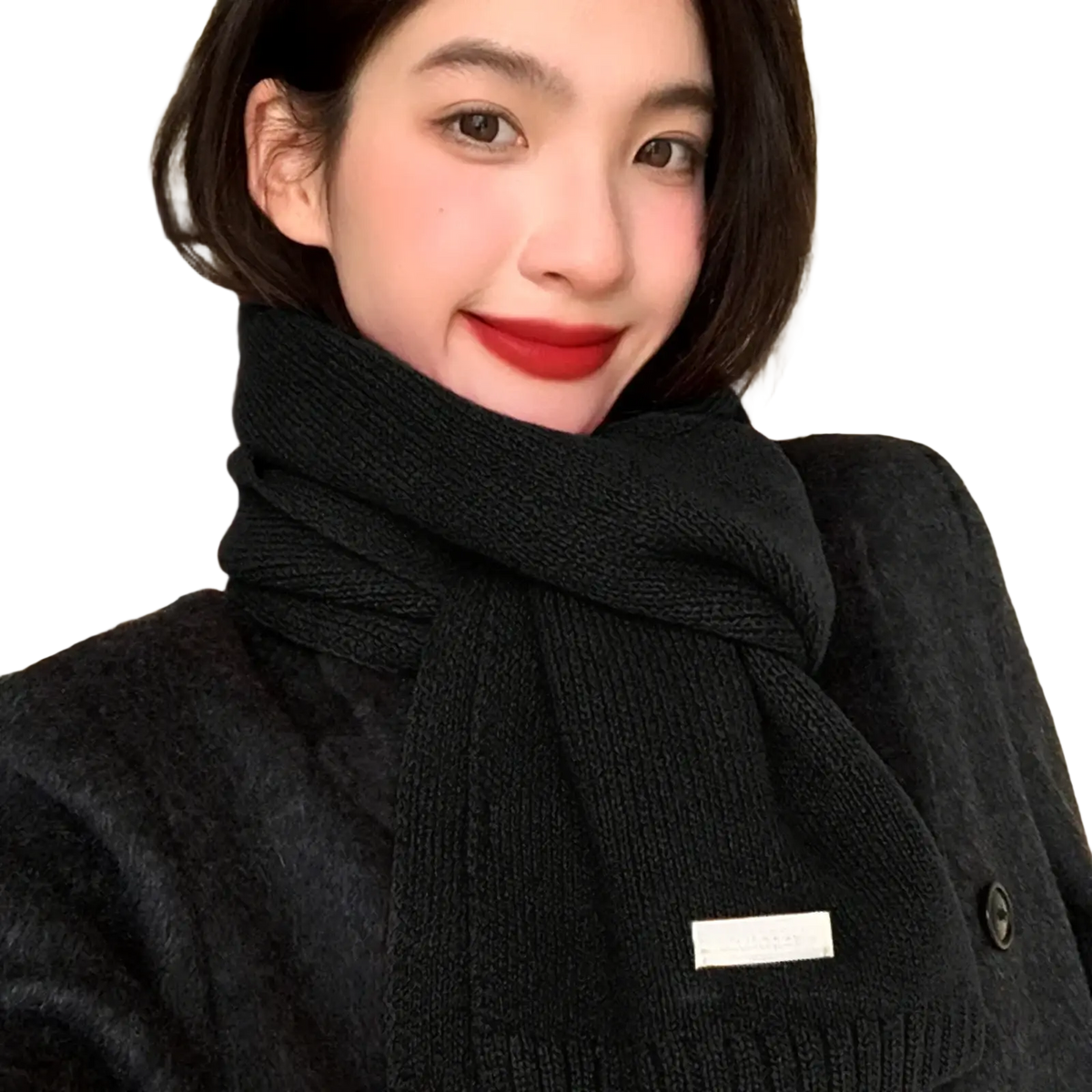 Black knitted winter scarf for men and women with ribbed texture and small rectangular label on the front