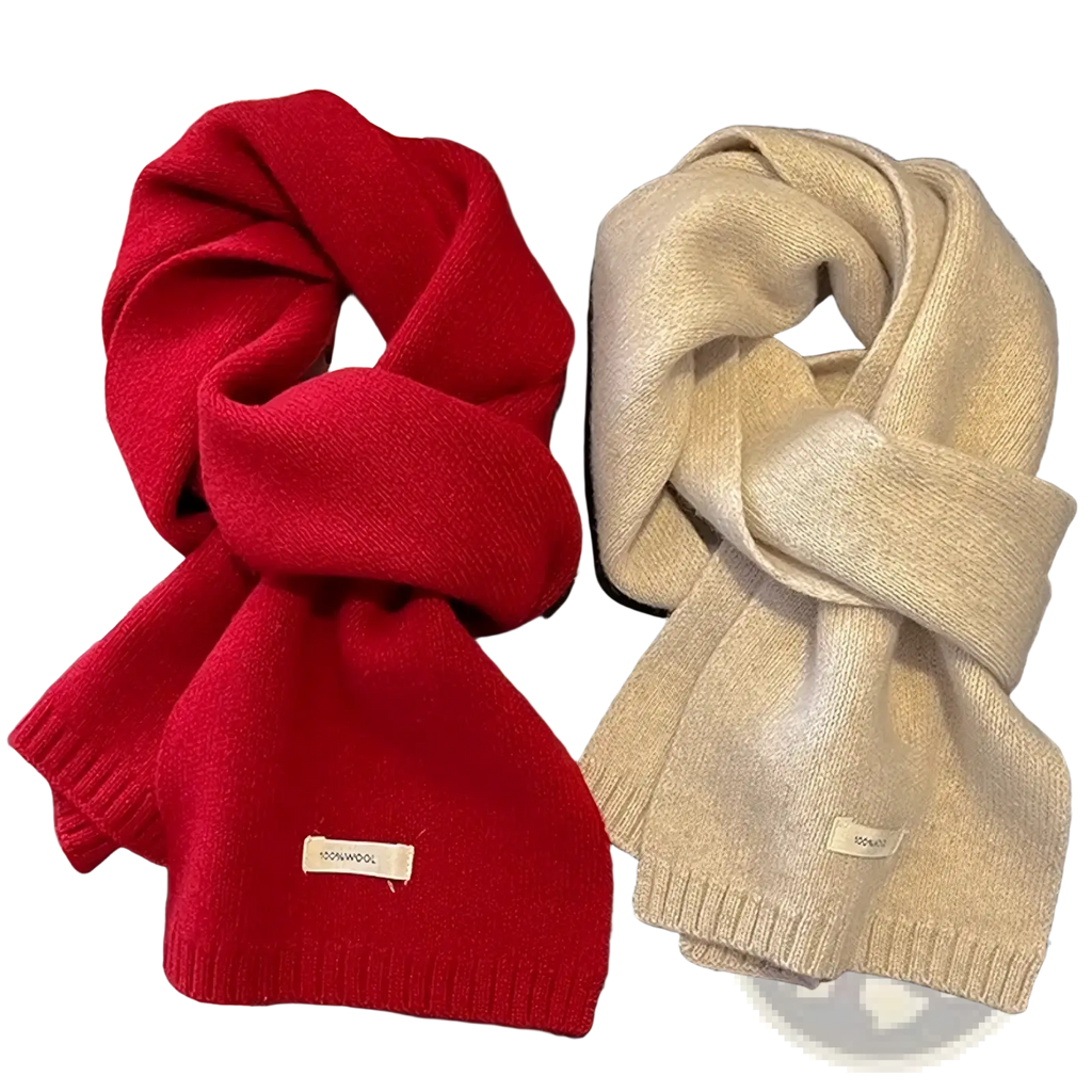 A cozy red and cream knitted wool scarf with ribbed edges and 100 percent wool label for men and women winter use