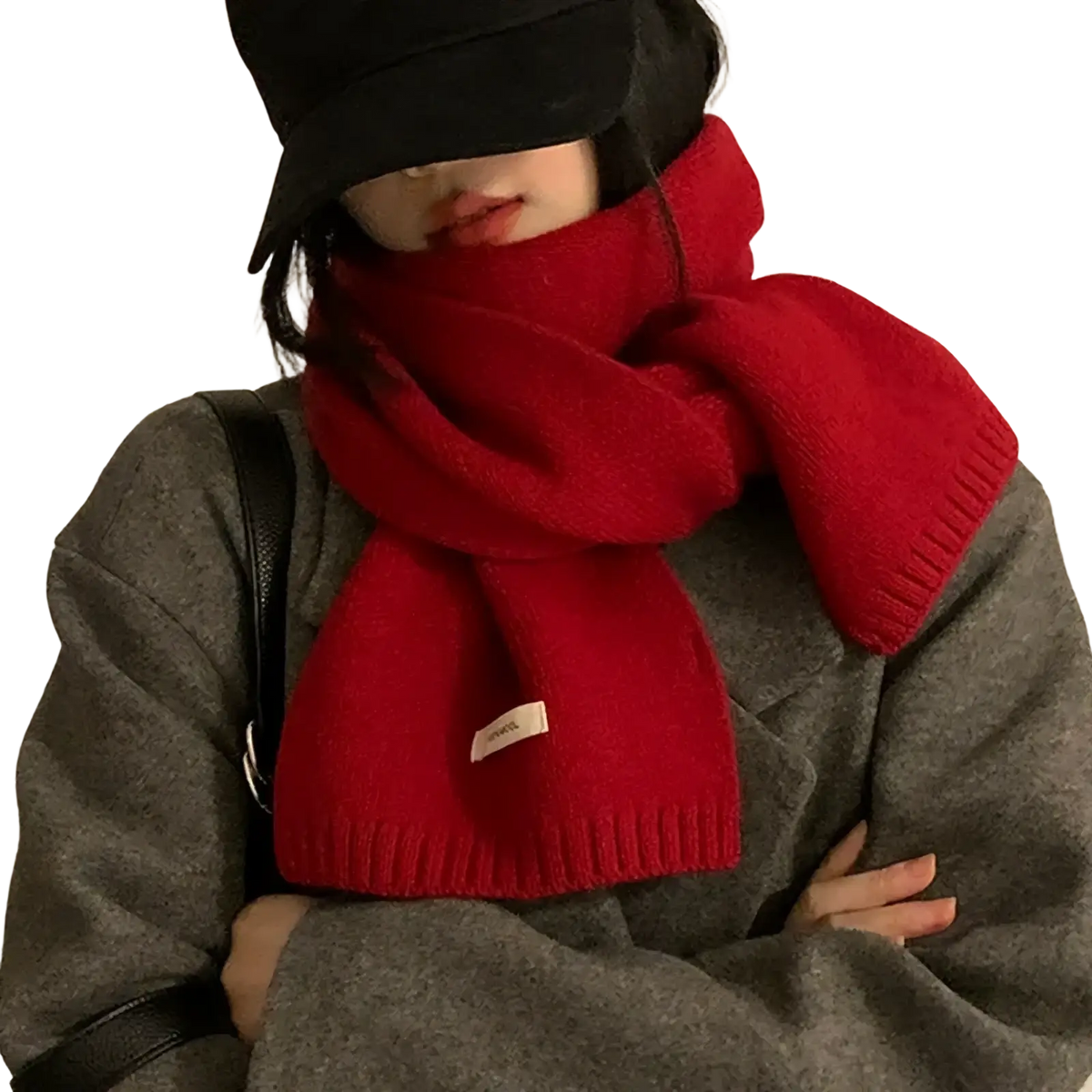 Red knitted winter scarf for men and women with vibrant ribbed edges and a small white label